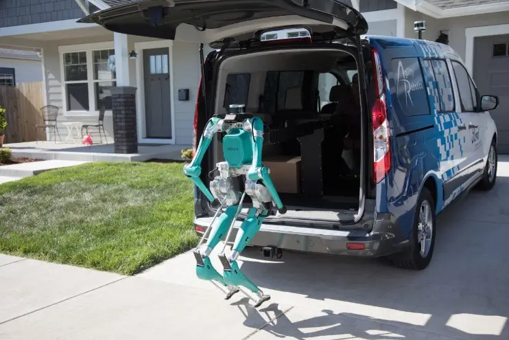 Agility Robotics' Digit robot unloads a package to deliver